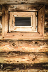 The window in the wood bathhouse closeup.