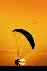 paraglider at sunset