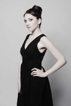 Elegance woman in black dress. 
