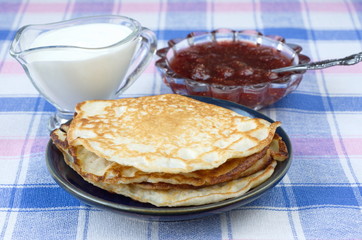 Pancakes with sour cream and jam
