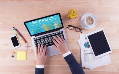Businessman is working on desk - PAY PER CLICK