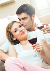 couple celebrating with redwine