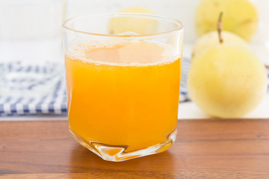passion fruit and Juice in glass on wood table