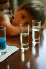 Dad with a child experimenting with vegetable oil