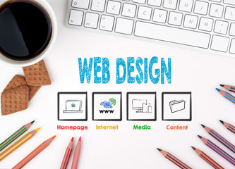 Web Design. White office desk Computer keyboard, coffee mug and colored pencils.