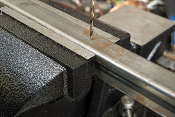 Drilling a square steel tube on the bench vise