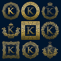 Vintage monograms set of K letter. Golden heraldic logos in wreaths, round and square frames.