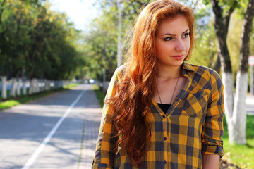 red-haired girl in a hat hipster