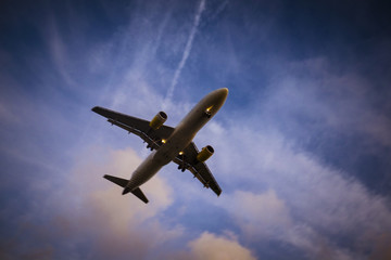 Plane is landing during a nice sunset