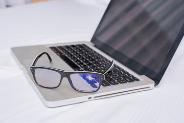 glasses and laptop, glasses and notebook