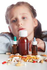 Little sick girl does not want to take medication