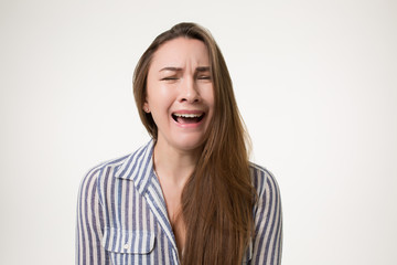 girl crying painfully and screaming isolated