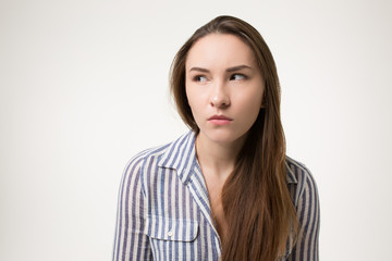 Obraz premium girl is looking suspiciously and mistrustfully isolated