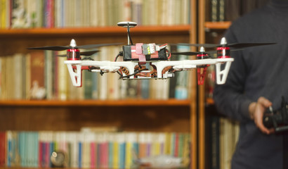 person flying a drone indoors