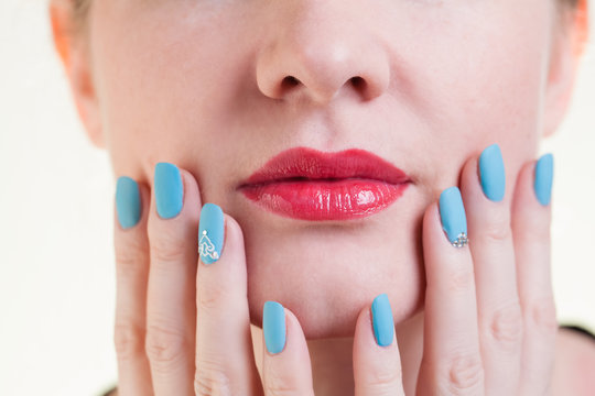 Beauty model girl isolated on background. Portrait of a young blond woman Slav. True emotions. Red lips and manicure