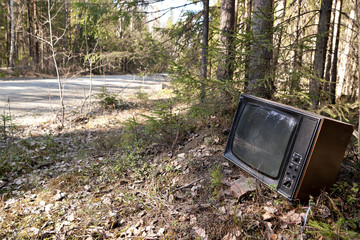 Restored vintage TV lying on the roadside