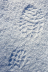 Traces from boots on snow, background