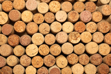 Background of used wine corks. Wall of many different wine corks. Closeup of wine corks.