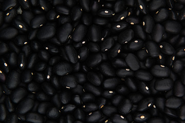Black kidney beans closeup top view background. Healthy protein food.