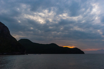 Sunrise on Island in the Sea with Cloudy Sky.
