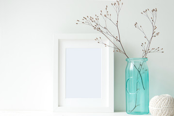 Minimal white frame with turquoise vase