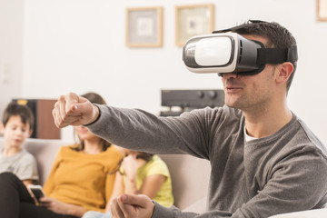 young man uses a virtual reality glasses , VR mask