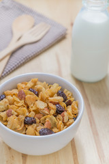 Corn flakes nutrition cereal and milk on wooden surface for healthy breakfast