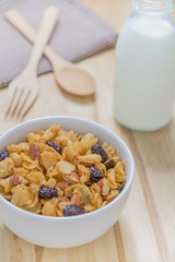 Corn flakes nutrition cereal and milk on wooden surface for healthy breakfast