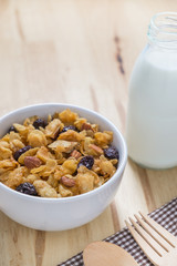Corn flakes nutrition cereal and milk on wooden surface for healthy breakfast