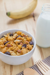 Corn flakes nutrition cereal and milk on wooden surface for healthy breakfast
