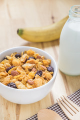Corn flakes nutrition cereal and milk on wooden surface for healthy breakfast