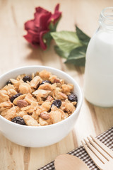 Corn flakes nutrition cereal and milk on wooden surface for healthy breakfast