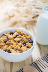 Corn flakes nutrition cereal and milk on wooden surface for healthy breakfast