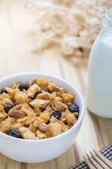 Corn flakes nutrition cereal and milk on wooden surface for healthy breakfast