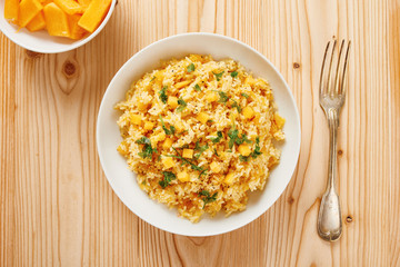 Pumpkin risotto on white dish