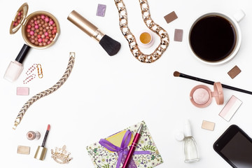 Flat lay of women cosmetics and accessories, pen, envelope, black coffee and a mobile phone on white background.