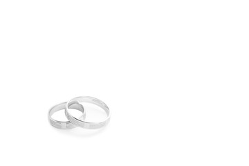 Wedding rings on wedding card on a white background