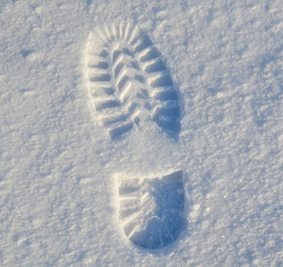 Winter high boot footprint on the first snow