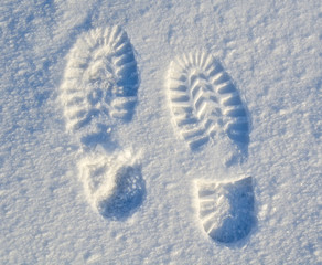 foot steps on snow ground on the first snow