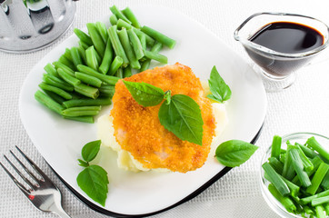 Chicken nuggets, mashed potatoes and green beans