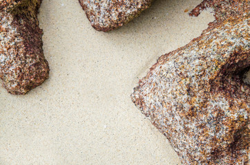 sand beach with rock frame with copyspace for text