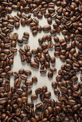 Coffebeans on Neutral Gray Background. Dark Roast Coffee.