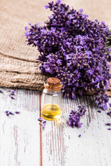 Obraz na płótnie Canvas Lavender flower, oil on wooden background, Nature Lavender product 