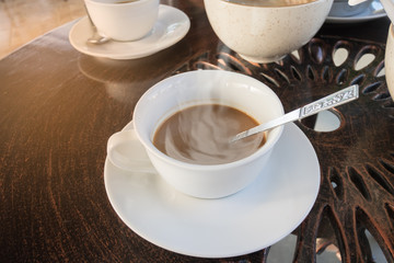 Hot coffee cup and breakfast on table in the morning