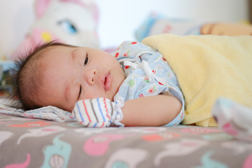 Newborn Asian baby girl sleeping