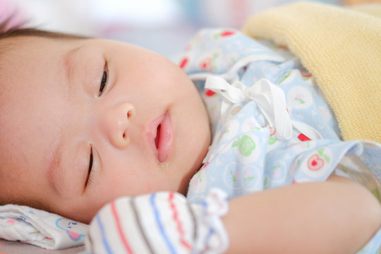Newborn Asian baby girl sleeping