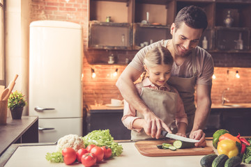 Father and daughter cooking