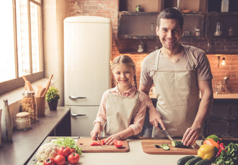 Father and daughter cooking