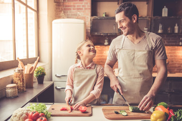 Father and daughter cooking