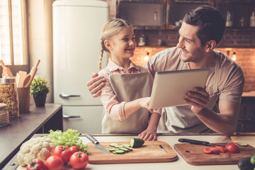 Father and daughter cooking